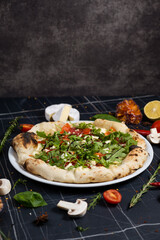 Salmon and arugula pizza. Light and tasty restaurant meal for a foodie