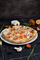 pizza tuna on black background top view