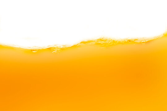 The surface of the orange water ripples looks like beer.