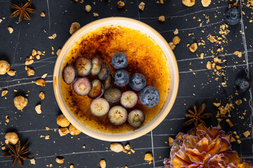 Cr?me br?l?e, creme brule. Classic creme brul? being flamb?. Burning, flaming, ramekins, vanilla...