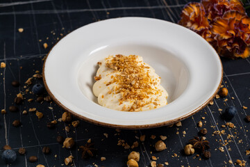 Tiramisu. Traditional italian dessert on white plate, wooden background. Selective focus