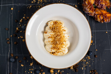 Tiramisu. Traditional italian dessert on white plate, wooden background. Selective focus