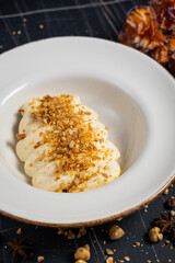 Tiramisu. Traditional italian dessert on white plate, wooden background. Selective focus