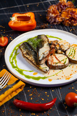 baked mackerel fish in a pan with lemon herbs and spices, banner, menu recipe place for text, top view,