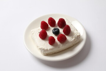 Сottage cheese with berries in a plate