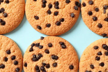 Cookies with chocolates on a colored background
