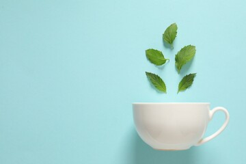white cup with mint tea. tea party concept