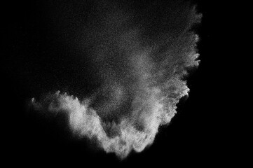Abstract dust overlay texture. Freeze motion of white particles on black background. Powder explosion.	