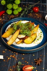 potatoes fried in a pan, rustic style, horizontal view from above