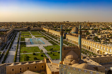 Iran. Isfahan. Naqsh-e Jahan Square (UNESCO World Heritage Site) and minarets of the Shah Mosque, Ali Qapu Palace (left), Sheikh Lotfollah Mosque (right)
