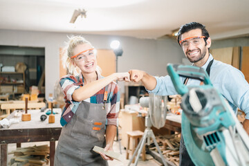 In a carpenter's shop, a skilled man with training in the craft uses tools to perform woodwork, blending occupation, industry, and business. - 763442087