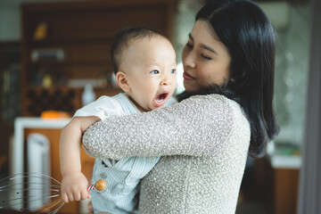 Portrait of enjoy happy love family asian mother playing with adorable little asian baby newborn...