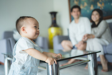 Portrait of enjoy happy love family asian mother playing with adorable little asian baby newborn infant, Mom touching care with cute son in a white bedroom.Love of family concept - 763442407