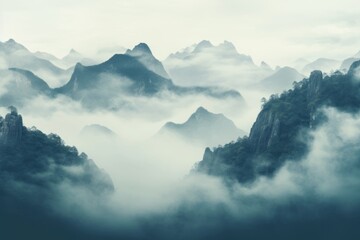 Enigmatic and mysterious wallpaper background featuring mist-covered mountains