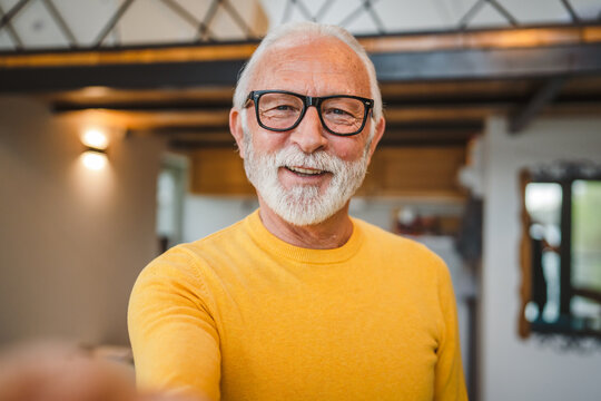 One senior man stand outdoor in his house happy confident portrait