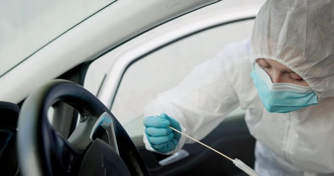 Science, csi and swab for dna sample in crime scene car for investigation of accident and burglary with hazmat..Forensic, research analysis and person with evidence collection for medical observation