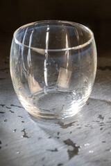 dirty transparent glass on a black slate board