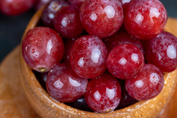 large red wet grapes in drops of water