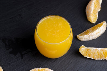 orange juice in a glass cup close-up © rsooll