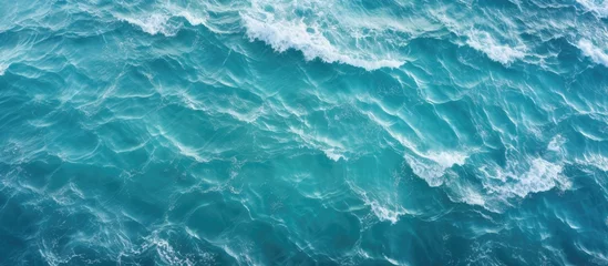 Foto auf Acrylglas Blue ocean waves closeup aerial view turquoise water surface texture © Ilgun
