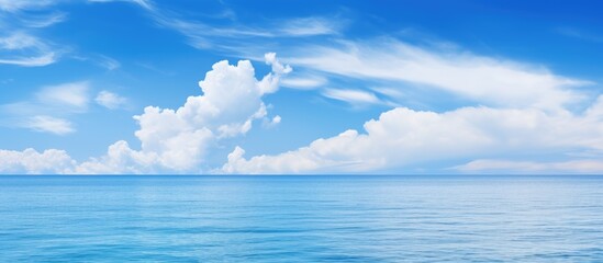 Calm ocean with cloud in sky