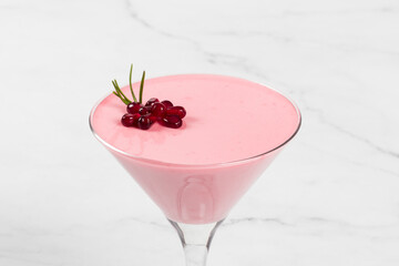 Pomegranate cream dessert, Panna Cotta in martini glass.  Close-up
