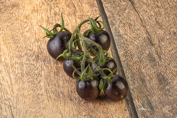 Ripe tasty black cherry tomato