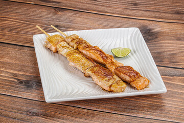 Grilled salmon skewer with sauce