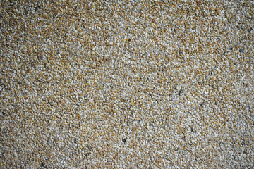Yellow / brown little stone wall background texture