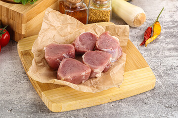 Uncooked raw pork tenderloin medallions