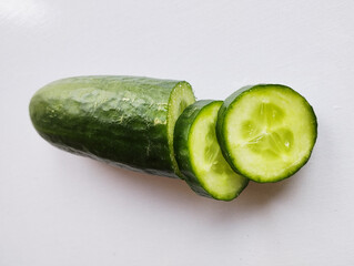Cucumber slices isolated on white background, cucumber on a cutting board, cucumber on a wooden...