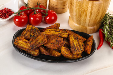Golden baked potato Idaho with spices