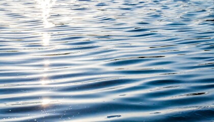 white water with ripples on the surface defocus blurred white colored calm calm water surface...