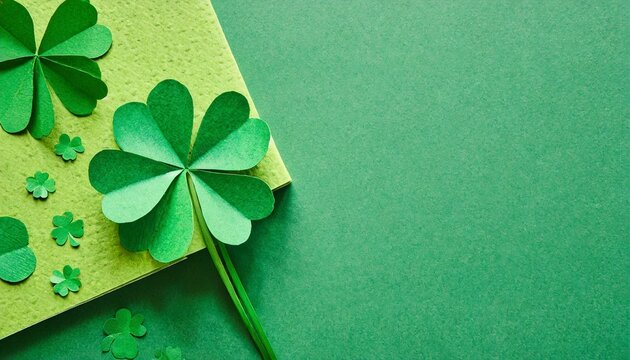 st patrick s day green background with clover leaves shamrock and four leafed copy space paper craft