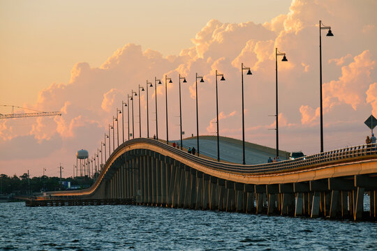 Barron Collier Bridge and Gilchrist Bridge in Florida with moving traffic. Transportation infrastructure in Charlotte County connecting Punta Gorda and Port Charlotte over Peace River