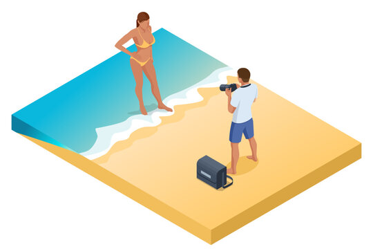 Isometric Young man making photo of his wife or woman at tropical beach. Young man using a professional camera