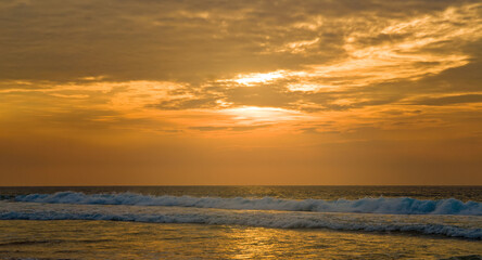 Naklejka na ściany i meble Tropical sea and sunrise. Wide photo.