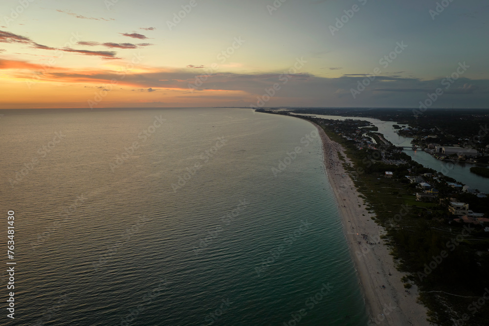 Canvas Prints High angle view of crowded Nokomis beach in Sarasota County, USA. Many people enjoing vacations time swimming in ocean water and relaxing on warm Florida sun at sundown