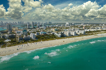 Miami Beach is popular vacation spot in southern Florida. Sandy beach surface and tourist...