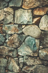 Stone Mosaic Wall Texture. This image displays a detailed stone mosaic, with a rich tapestry of naturally colored stones fitting tightly together.	
