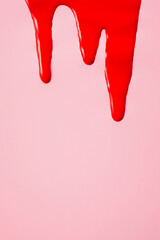 Blood on pink background. First menstrual period concept, menstruation cycle period, menstruation cycle period