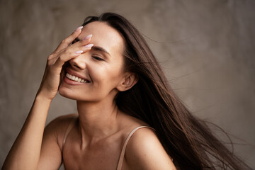 Obraz premium Photo of lovely natural beauty lady no filter touch face soft skin applying anti age cream isolated on grey concrete wall background