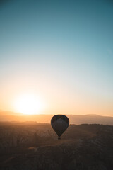 Sunrise with Hot Air Balloons over the epic Goreme, Cappadocia (Kapadokya) National Park, with...