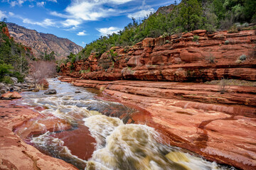 Oak Creek rushes through a red rock canyon near Sedona Arizona - 763486293