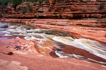 Oak Creek flows over red sandstone at Slide Rock State Park near Sedona Arizona - 763486484