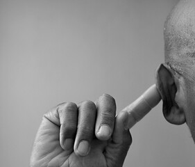 deaf man suffering from deafness and hearing loss on gray background with people stock image stock...