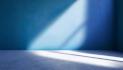 beautiful original background image of an empty space in blue tones with a play of light and shadow on the wall and floor for design or creative work