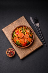 Delicious healthy vegetables steamed carrots, broccoli, asparagus beans and peppers