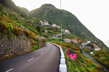 Papier Peint photo Atlantic Ocean Road Mountain road leading to Porto Moniz on the north coast of Madeira island (Portugal) in the Atlantic Ocean