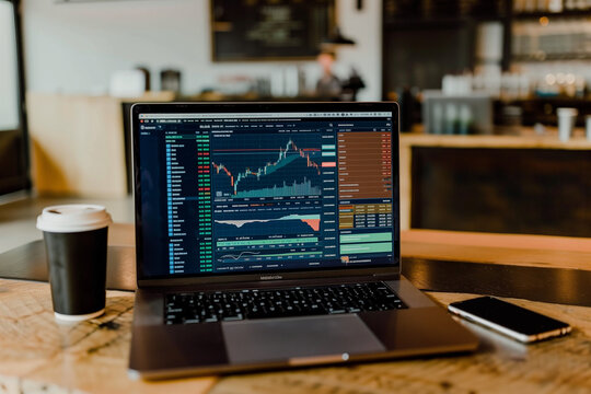 Financial stock market on a laptop screen. Stock market curve on screen. Investing in the stock market. Sotck exchange. Stock market training.